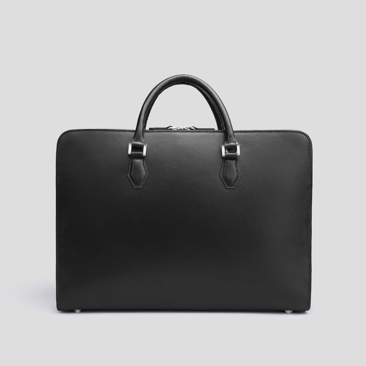 Black leather briefcase on a light gray background