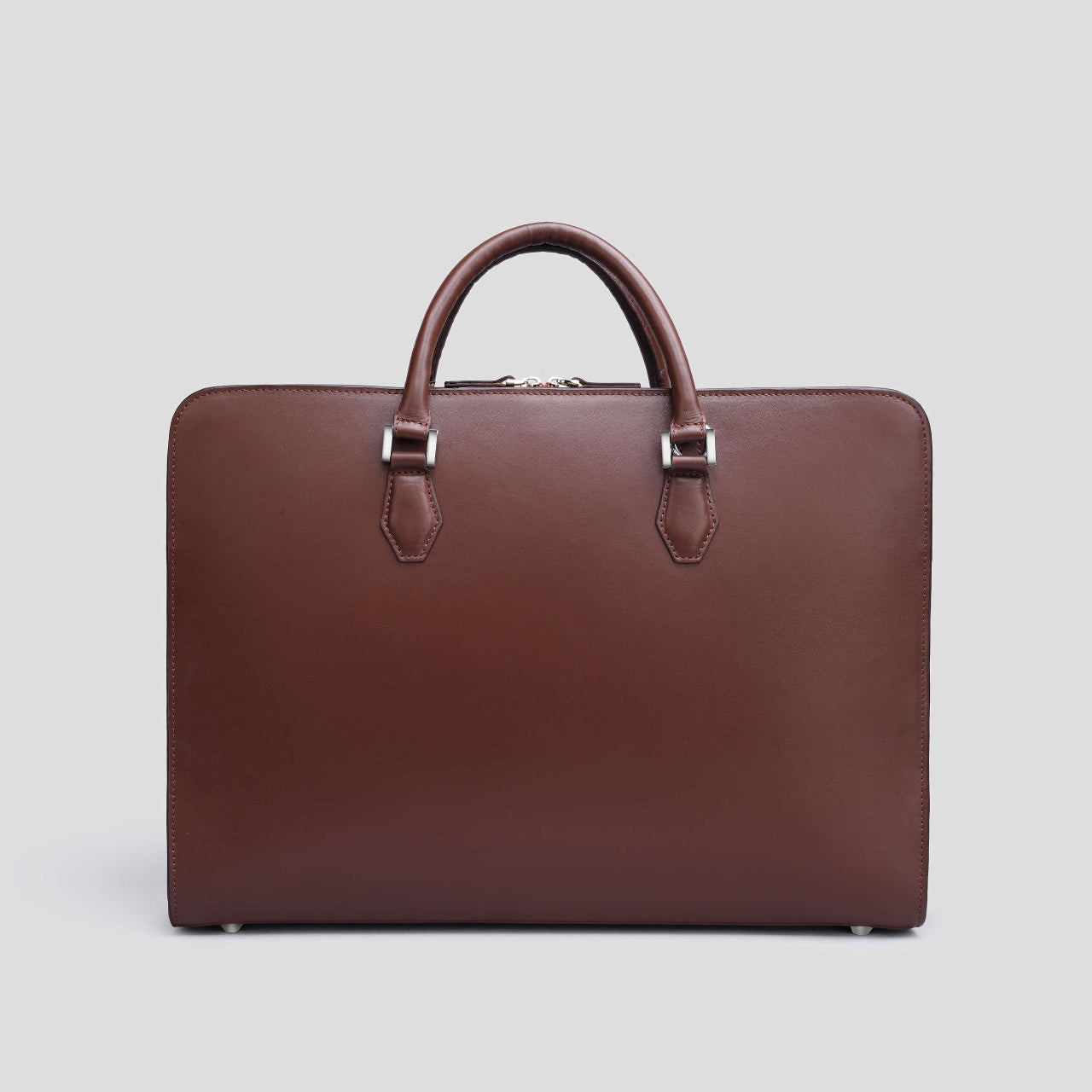 Brown leather briefcase from the brand DISTINCT on a light gray background
